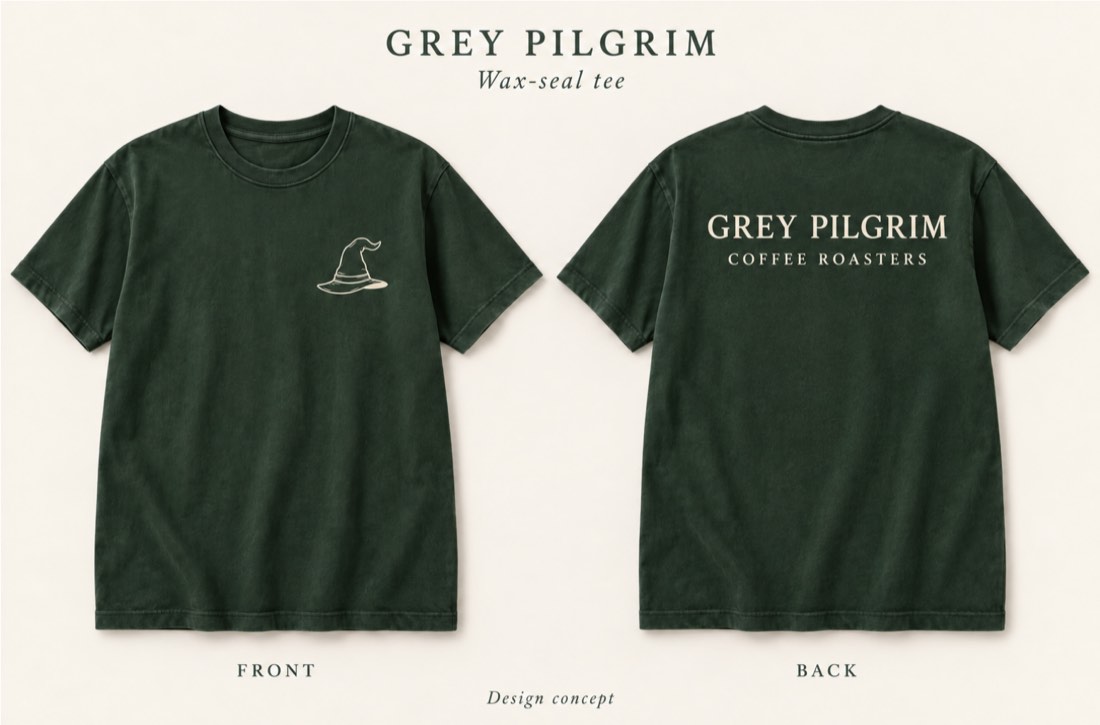 Wax-seal tee in forest green — small hat mark on the front chest, GREY PILGRIM COFFEE ROASTERS across the back